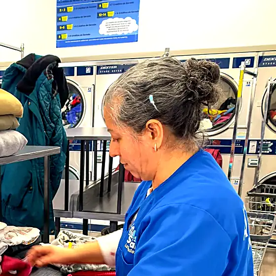 A team member folding a customer's order